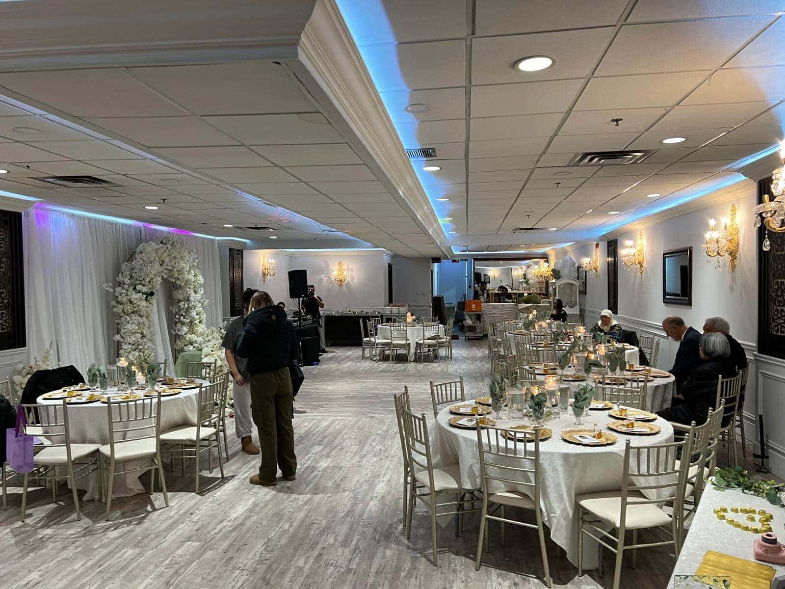 The Junior Ballroom laid out with round tables for an intimate gathering.